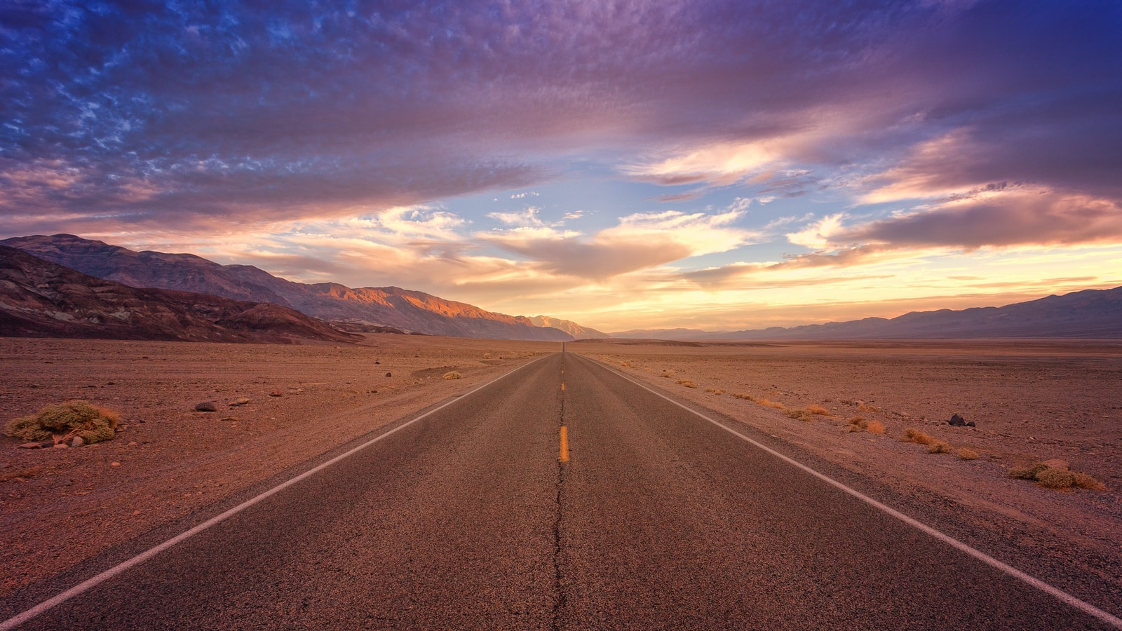 brown concrete road during daytime