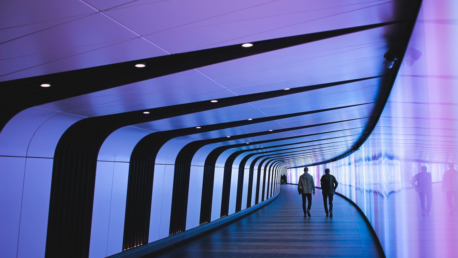 man walking through pathway